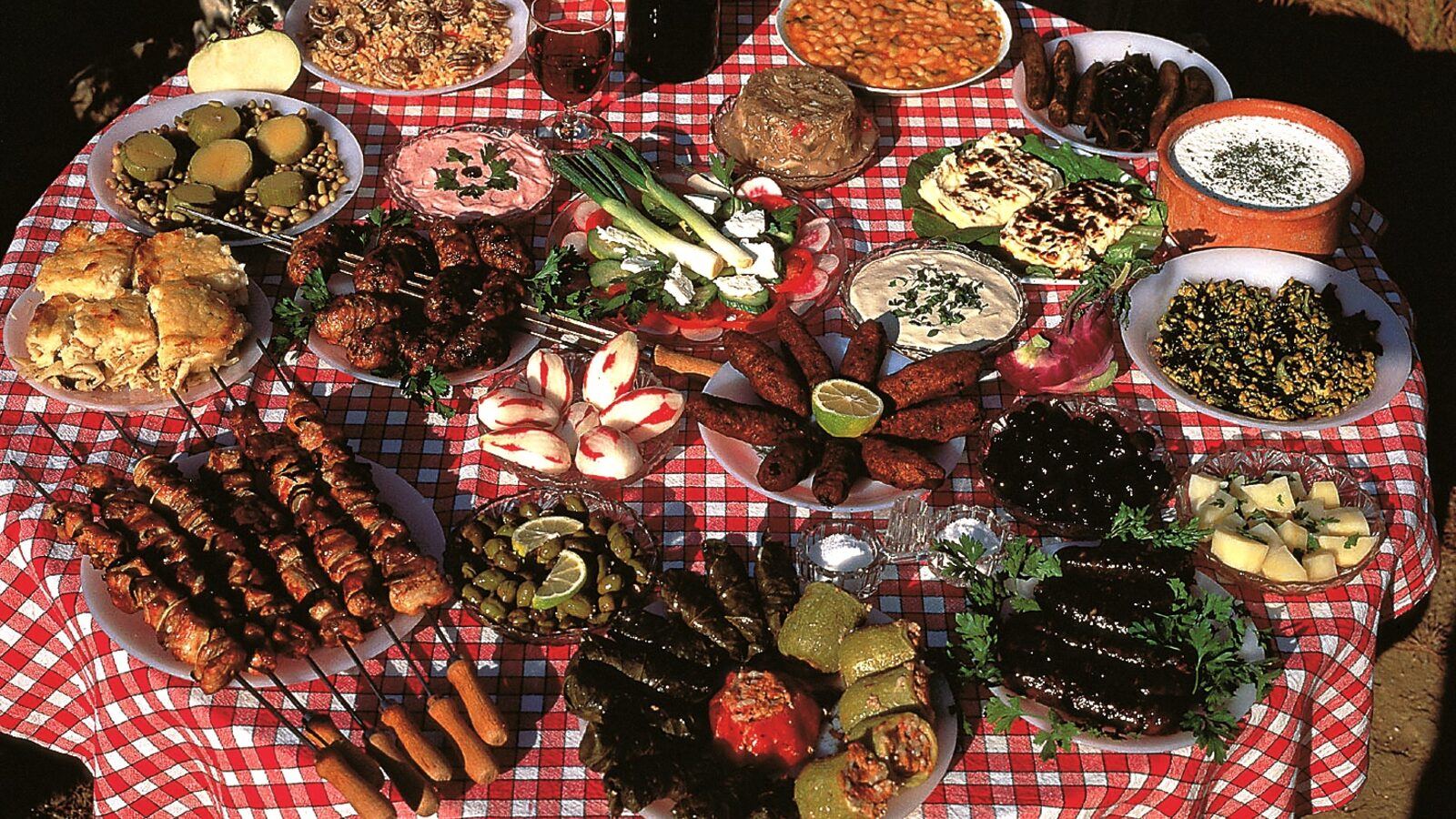 A Cyprus meze table loaded with small dishes